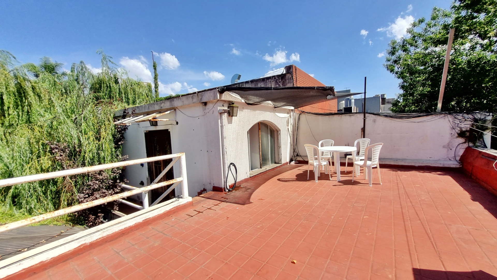 Rooftop terrace of Casa Ombú with red tiles