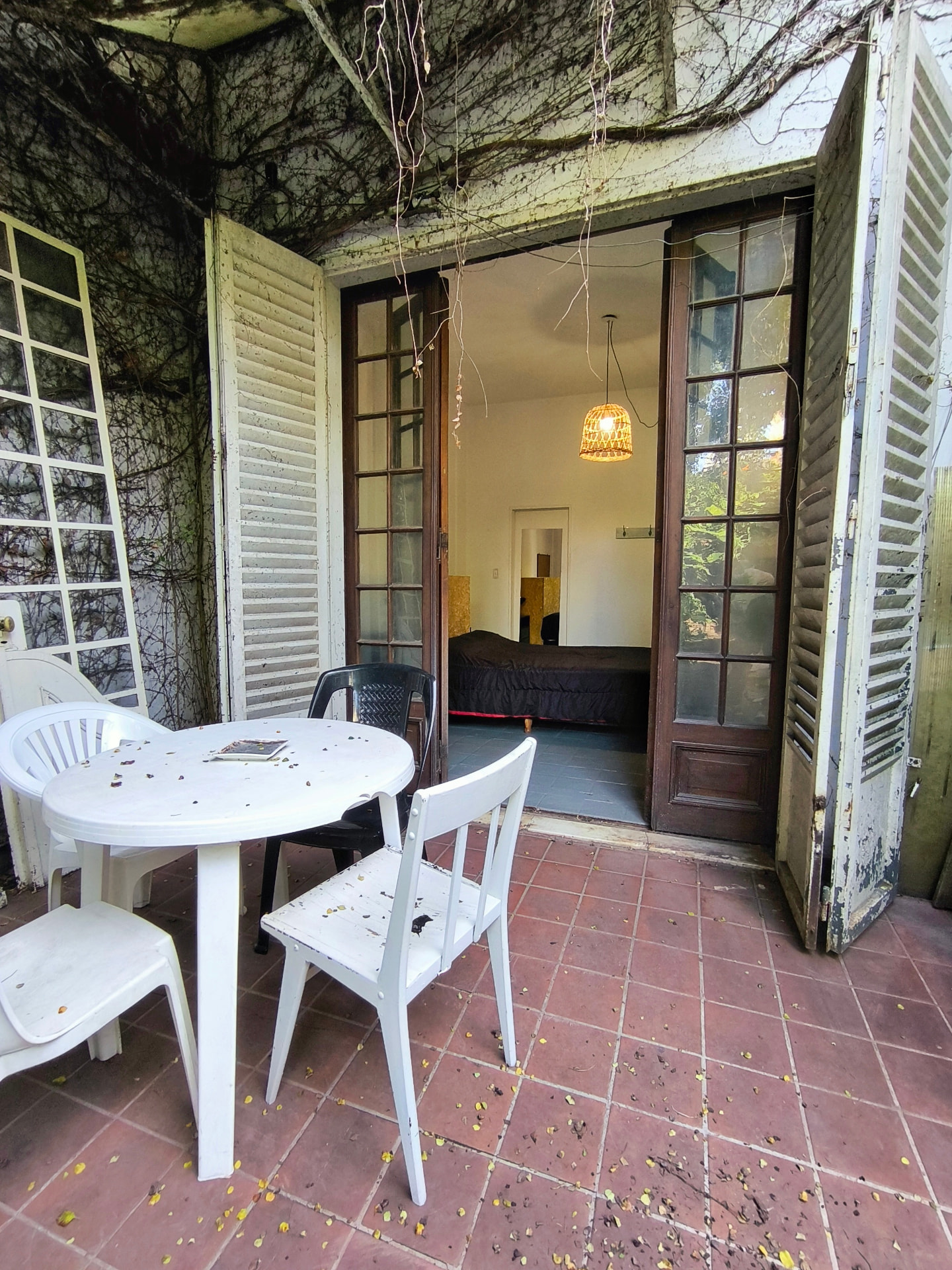 Gallery of Casa Ombú with french doors opening to the garden